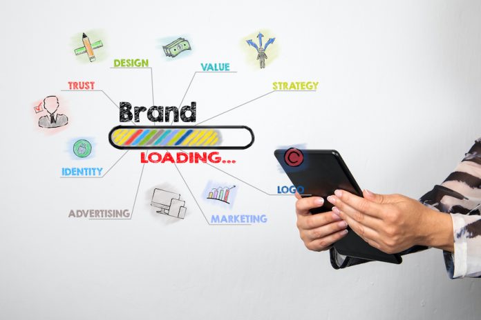 SEO reputation management Woman holds tablet whilst brand is loading